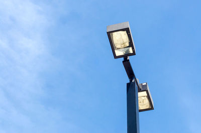 Low angle view of street light against sky