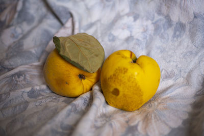 High angle view of yellow fruits on bed