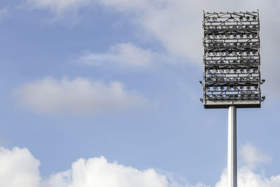 Low angle view of communications tower against sky