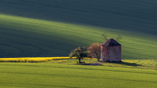 Scenic view of farm against clear sky