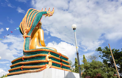 Low angle view of statue against sky