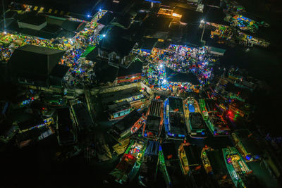 High angle view of illuminated buildings in city at night