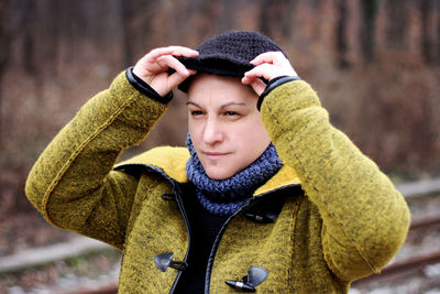 Portrait of young woman wearing hat