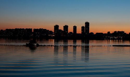 City lit up at dusk