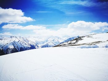 Scenic view of landscape against sky during winter