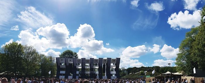 Panoramic view of people against sky