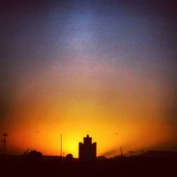 Silhouette of buildings at sunset