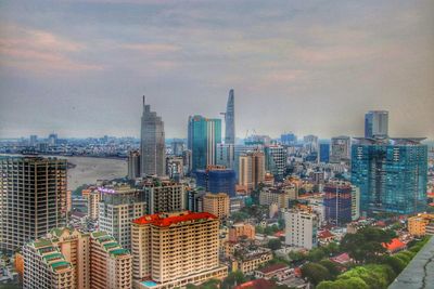 Modern buildings in city against sky