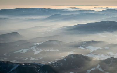 Scenic view of mountains against sky during sunset