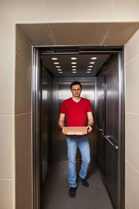 Rear view of man standing in building