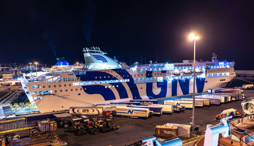 High angle view of illuminated ship moored at harbor