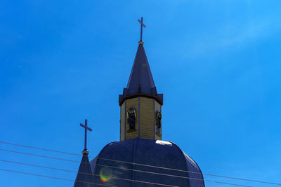 Low angle view of building against blue sky
