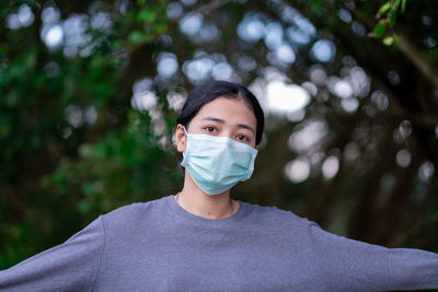 Portrait of young woman outdoors