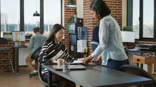 Businesswomen having discussion at office