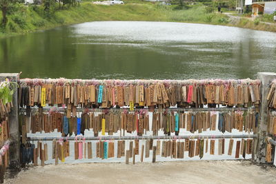 Multi colored wooden post in river