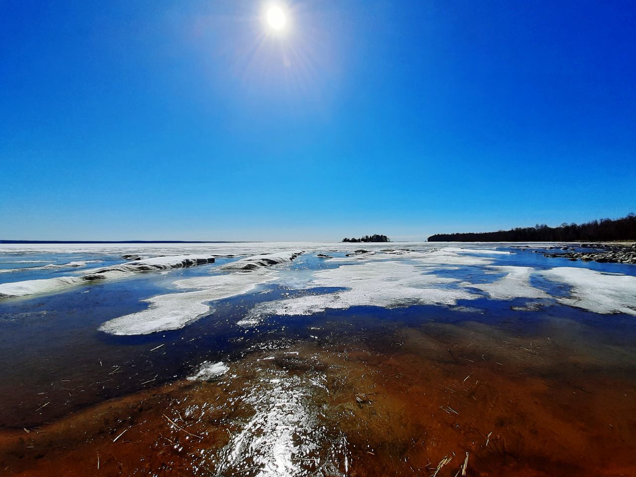 SCENIC VIEW OF SEA AGAINST SKY DURING WINTER