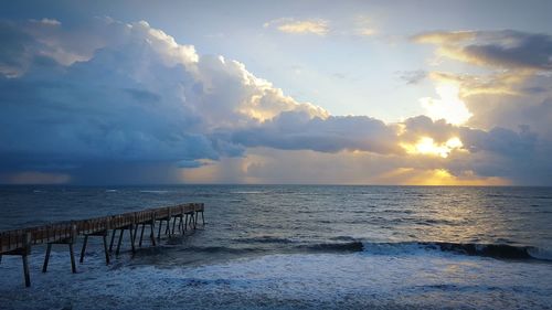 Scenic view of sea against sky at sunset