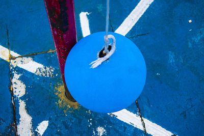 High angle view of decoration hanging against blue wall