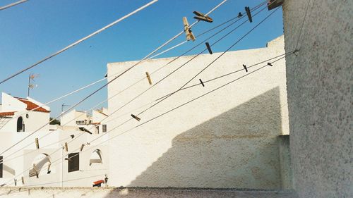 Low angle view of buildings against blue sky