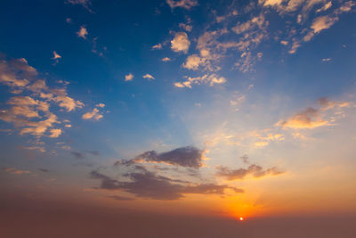 Low angle view of dramatic sky during sunset