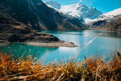 Scenic view of lake and mountains against sky