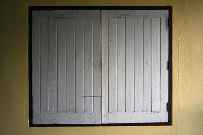 Close-up of closed window on wall