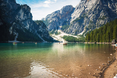 Scenic view of lake and mountains against sky