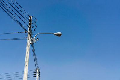 Low angle view of street light against sky