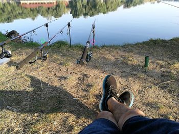 Low section of man legs by lake