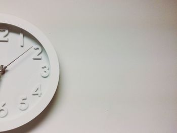 Close-up of clock on wall