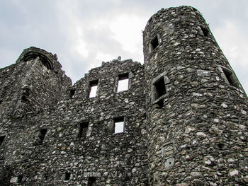 Low angle view of old building against sky