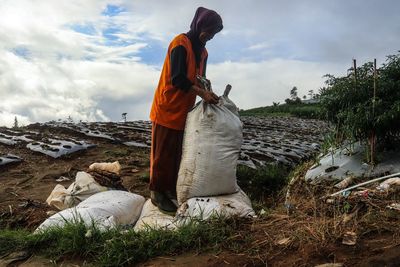 Side view of a woman walking on land