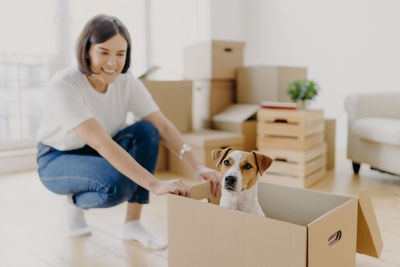 Woman with dog on floor