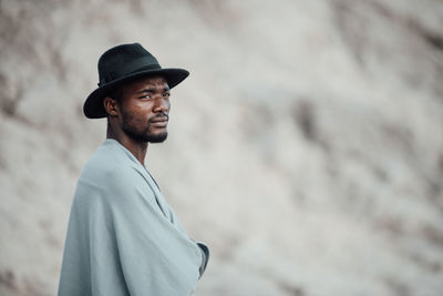 Portrait of young man looking away