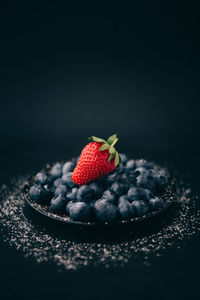 Close-up of strawberries in plate on table