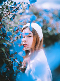 Portrait of young woman looking away