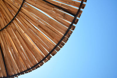 Low angle view of built structure against clear blue sky