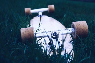 Close-up of skateboard on field