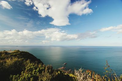 Scenic view of sea against cloudy sky