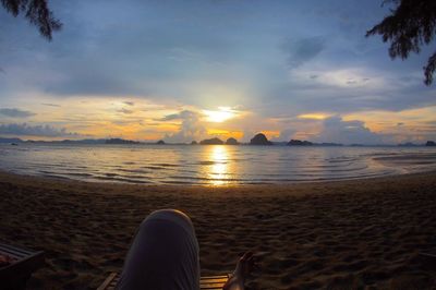 Scenic view of beach against sky during sunset