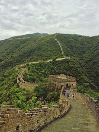 Scenic view of mountain against cloudy sky