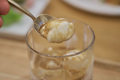 Close-up of hand holding ice cream