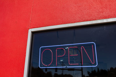 Close-up of text on red wall