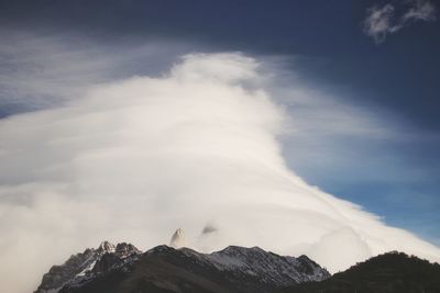 Low angle view of majestic mountains against sky