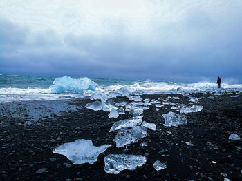 Scenic view of sea against sky during winter