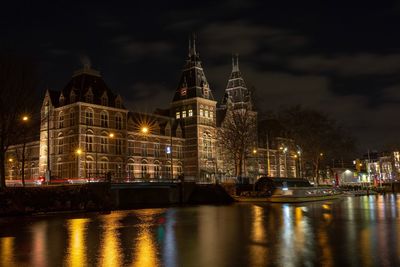 Reflection of illuminated buildings in water at night