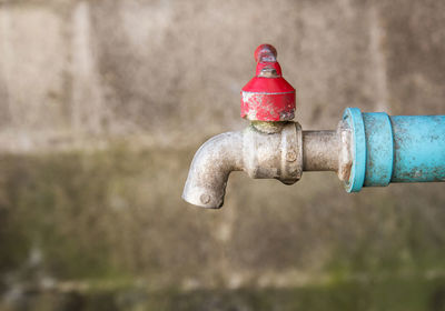 Close-up of water pipe against wall