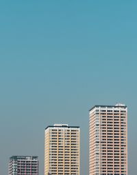 Modern skyscrapers against clear sky