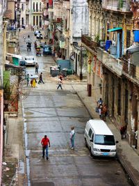 High angle view of people walking on road