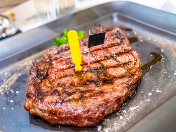 High angle view of meat on barbecue grill